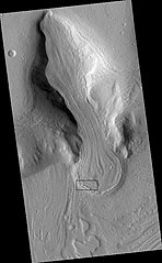 Glacier as seen by HiRISE under the HiWish program. Area in the rectangle is enlarged in the next photo. Zone of accumulation of snow at the top. Glacier is moving down valley, then spreading out on plain. Evidence for flow comes from the many lines on surface. Location is in Protonilus Mensae in Ismenius Lacus quadrangle.