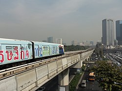 BTS Skytrain heading to Lat Phrao Square above Phaholyothin Road (taken from Chomphon side)