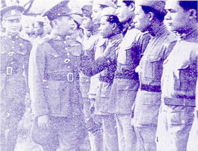 Prime Minister Plaek Phibunsongkhram inspecting troops during the Franco-Thai War.