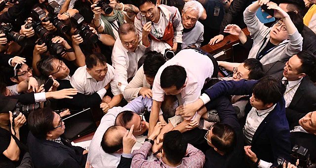 Members of two rival camps pushed and shoved each other in the Bills Committee meeting on 11 May 2019.