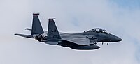 An F-15E Strike Eagle, tail number 01-2003, taking off from RAF Lakenheath in England. The aircraft is assigned to the 494th Fighter Squadron.