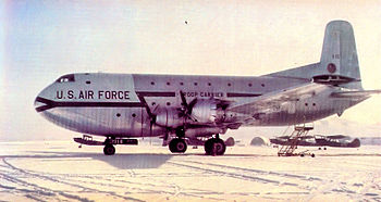 A large four-engined transport aircraft sitting on the ground