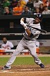 A man in a grey baseball uniform with 