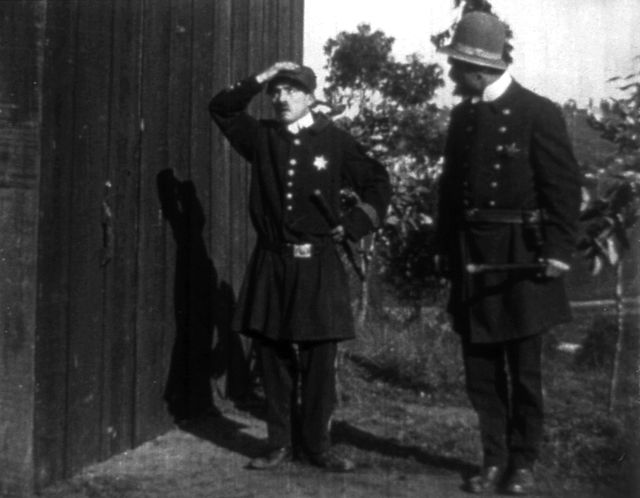 The Thief Catcher (1914) with Charlie Chaplin (left) as a Keystone Cop