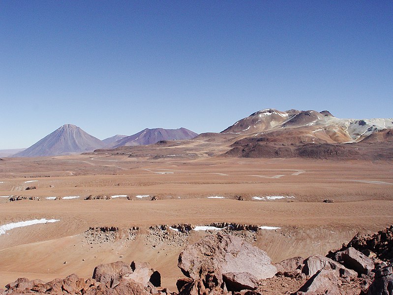 File:A view across the plains of Chajnantor with the ALMA construction site at the centre.jpg