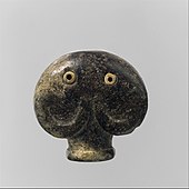 Amulet in the form of a head of an elephant; 3500–3300 BC; serpentine (the green part) and bone (the eyes); 3.5 × 3.6 × 2.1 cm; Metropolitan Museum of Art (New York City)