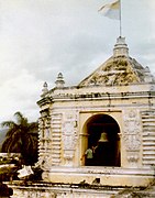 Bell ringer ringing bell in tower of La Merced Church, Antigua Guatemala.