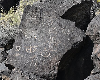 Assorted petroglyphs on a rock