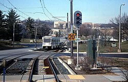 Baltimore Light Rail train entering Gilroy Road station, March 2000.jpg