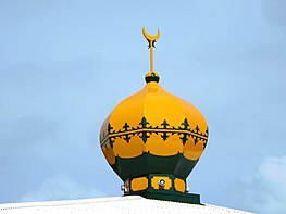 The bright yellow minaret atop the mosque on Home Island, Cocos (Keeling) Islands. Bright Yellow Dome (25086334622).jpg