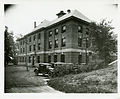 Northwest view of the North Building, showing the the transformer cage at the west end and the boiler room at the east end of the building