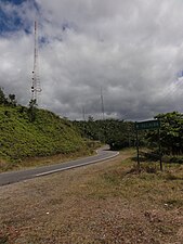 PR-143 (Ruta Panorámica) east in Barrio Anón, Ponce, approaching PR-577 (on the left), which leads to Cerro Maravilla. Note the white "PR-577" road sign barely visible on the right