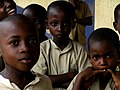 three children looking directly at camera