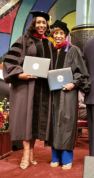 Dawnn Lewis and Marla Gibbs receiving honorary Doctor of Humane Letters degrees from Next Dimension University on August 17, 2019.