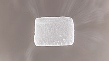 Subliming dry ice pellet, with white frost on the surface Dry Ice 1.jpg