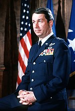 Thumbnail for File:Gen. Duane Cassidy seated on desk at AAVS sound stage during video taping.jpg