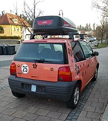 Car with maximum speed reduced to 25 km/h (16 mph), hence using an insurance plate German microcar - right.jpg