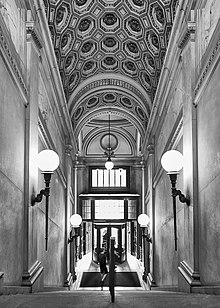 View down the main staircase, looking from the reading room toward the entrance vestibule Gould Memorial Library Exit.jpg