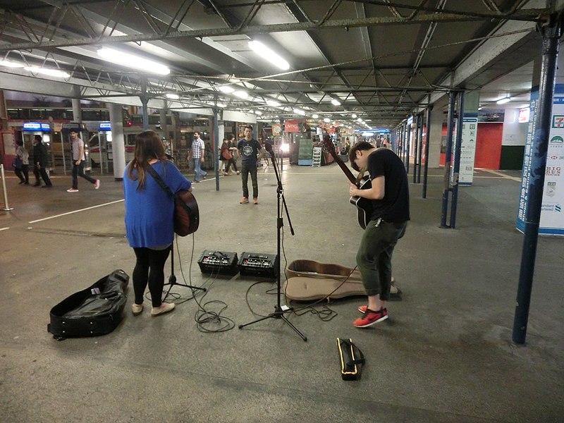 File:HK TST Star Ferry Piers night street musicians Apr-2013.JPG