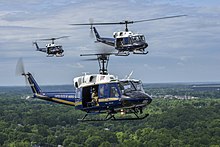 The 1st Helicopter Squadron flies UH-1 Hueys over Washington, May 2019. Huey Trio UH-1Ns Fly Over Joint Base Andrews, MD, May 10, 2019.jpg