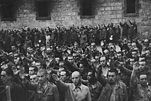 POW brigadiers in Cardena give the fascist salute, October 1938 International Brigades POWs in Cardena camp.jpg