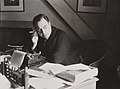 J B Priestley at work in his study, 1940. (7893553148).jpg