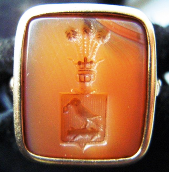 Polish signet ring in light-orange carnelian intaglio showing Korwin coat of arms