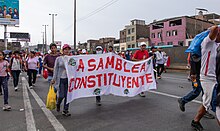 Protesters with a banner demanding a constituent assembly La Gran Marcha de los Conos de Lima 05.jpg