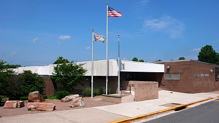 Langley High School, pictured here in June 2008, serves much of northeastern Fairfax County, Virginia. Visible on the left is the five stone memorial to the families affected by the September 11 attack on the Pentagon, the headquarters of the U.S. Department of Defense.