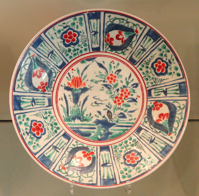 Large Export Dish, c. 1660–1670, Arita ware, hard-paste porcelain with overglaze enamels, the decoration drawing on Kraak ware Chinese export porcelai