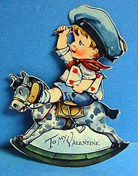 Mechanical Valentine from the 1920s of a boy sitting on a rocking horse