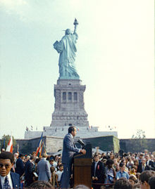 September 26, 1972: President Richard Nixon visits the statue to open the American Museum of Immigration. The statue's raised right foot is visible, showing that it is depicted moving forward.