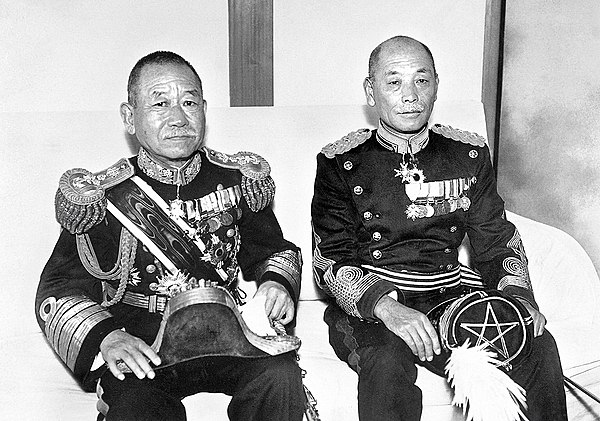 Okada (left) and Denzō Matsuo