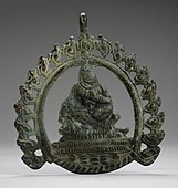 Pendant probably with Siddha; 8th–9th century; copper alloy; 8.89 by 7.93 by 0.31 centimetres (3.50 in × 3.12 in × 0.12 in); Los Angeles County Museum of Art (Los Angeles)