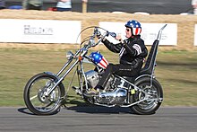 Peter Fonda rides a replica of the "Captain America" chopper used in the Easy Rider film PeterFondaCaptainAmerica-side.jpg