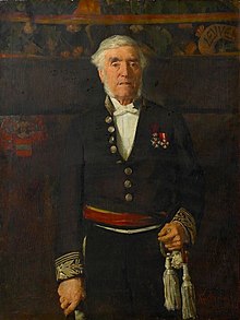 Portraitgemälde. Das Bild zeigt Leopold Vander Kelen als älteren, weißhaarigen Mann mit Backenbart. Er steht aufrecht und schaut den Betrachter an. Er trägt eine dunkle Uniform mit zwei Orden an der Brust. Seine rechte Hand stützt sich auf einen Stock, die linke ruht am Heft eines Schwertes. Der Hintergrund ist dunkel, man erkennt aber ein Wappen, den Schriftzug „LEUVEN“ sowie ein florales Muster am oberen Bildrand.