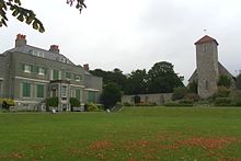 St Peter's Church and Preston Manor have stood together since the 13th century. Preston Manor, Brighton - Lawn to Rear (and St Peter's Church).jpg