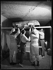 Disassembling the lid of one of the shrines Removing the lid of the outermost shrine.jpg