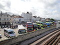 Ryde, Isle of Wight bus station, seen ahead of the Bestival 2011, with large crowds of people queuing for shuttle buses to the Bestival site.