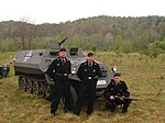 Medlemmar ur det historiska återskapade vallonska SS-frivilliga Corps Franc Wallonie med ett halvbandsfordon, Tatra OT-810 uppträdande som Sd.Kfz.250; Polen i maj 2007, Sanok-Błonia.