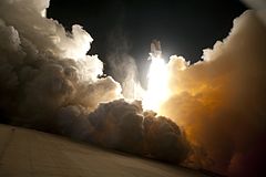 An exhaust cloud engulfs Launch Pad 39A during the launch.
