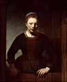 Samuel van Hoogstraten - Vrouw bij een half open deur.jpg