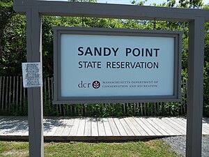 Entrance sign in the parking lot beneath Bar Head. Sandy Point Entrance Sign.JPG
