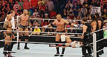 Heading into Extreme Rules, the Shield (right) would take on Evolution while Bryan (laying in the corner of the ring) would defend his title against Kane (in white shirt) Shield vs Evolution.jpg