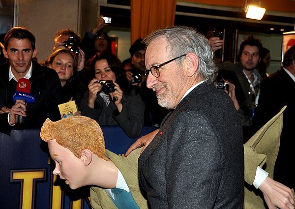 Steven Spielberg and a costumed character of Tintin at the film's premiere in Paris, 22 October 2011.