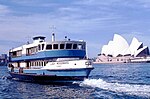 Sydney Ferry LADY WOODWARD по пътя към Неутралния залив, напускайки Circular Quay и Sydney Cove 15 октомври 1973.jpg