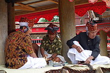 Three Toraja elders in traditional dress attending wake ceremony. March 2014. Toraja Elders.JPG