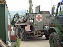 German Kosovo Force armoured medical transport, marked with the protective sign Transportpanzer SanitaeterMSA.jpg