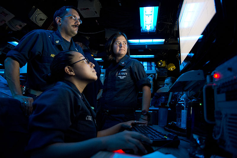 File:U.S. Navy Operations Specialist 2nd Class Yesenia Cruz, front, Senior Chief Operations Specialist Tom Aiello, left, and Operations Specialist 1st Class Jennifer Grieve send and receive messages in the combat 130629-N-WD757-045.jpg