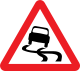 U.K. slippery road ahead sign.